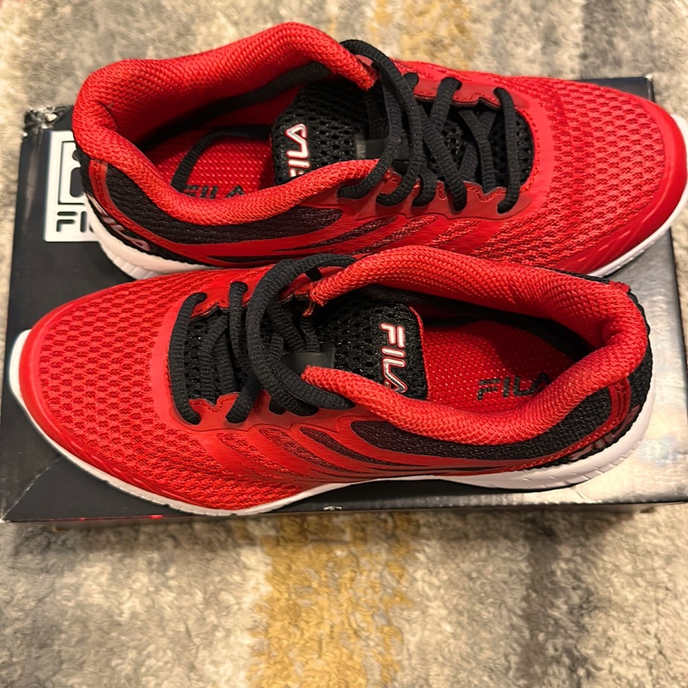 FILA SIZE 3.5 USA KID’S Red and Black tennis shoes.